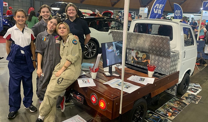 Students of Queenwood School, who have converted a petrol vehicle to an electric vehicle.